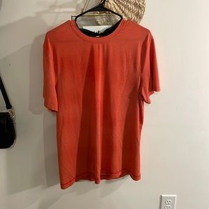 Lululemon size L, orange T shirt.
